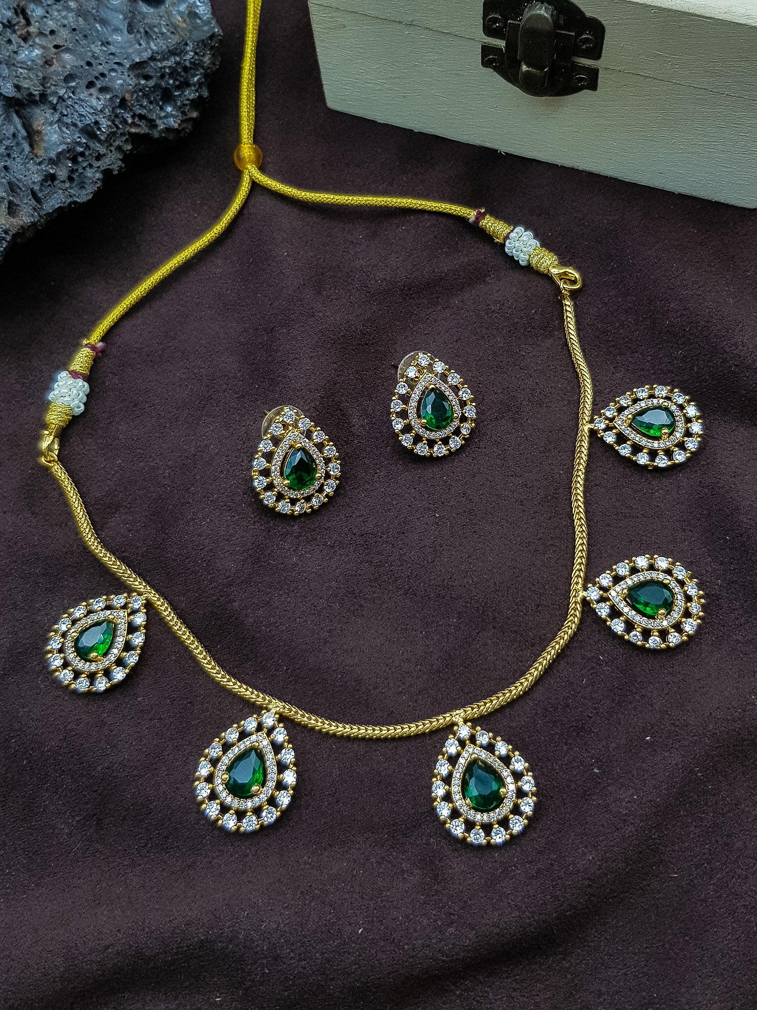 Drop design necklace in green white cz stones