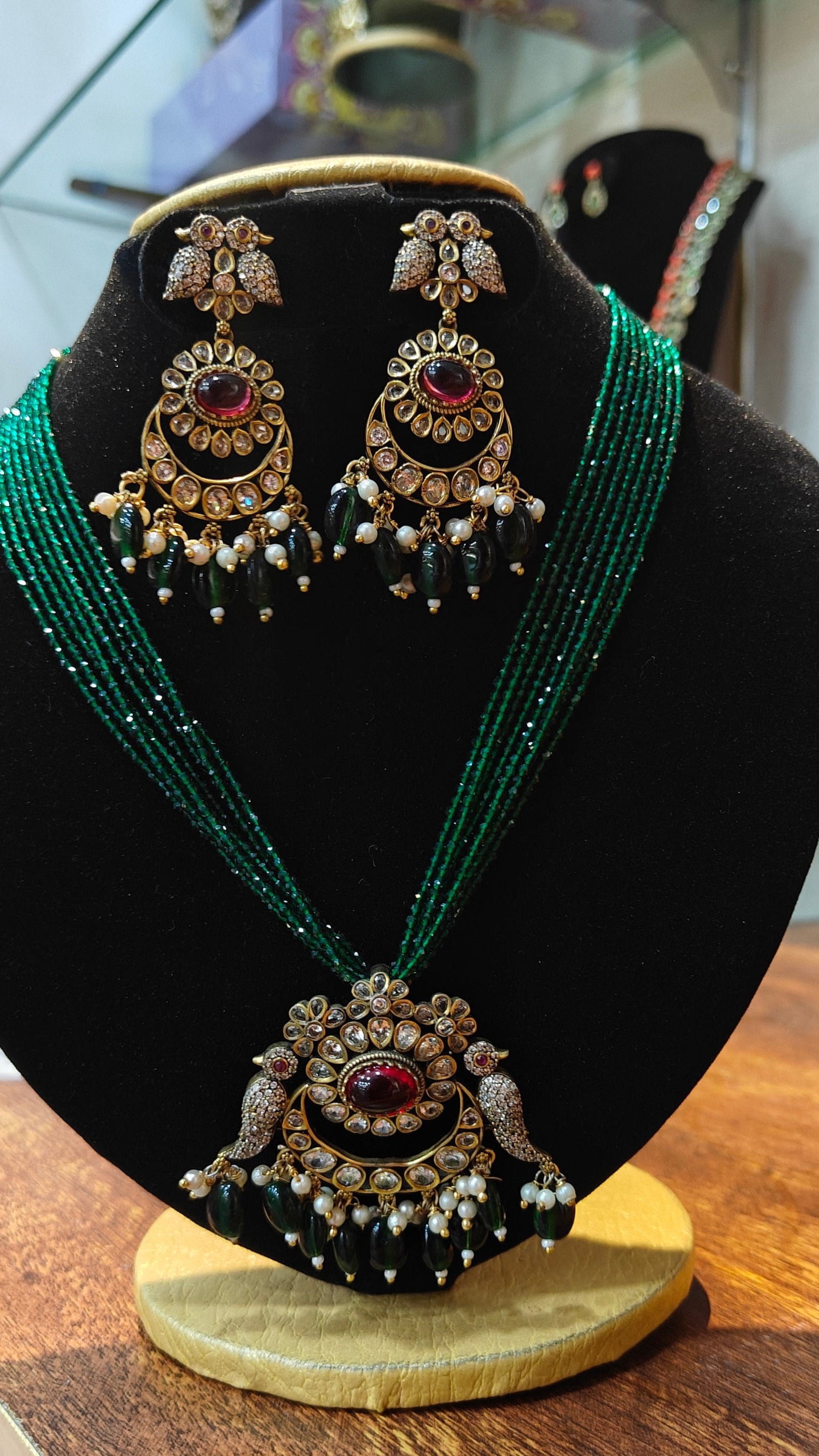 Gold Plated premium Necklace Set with Green Crystal Maala and Stone Pendant
