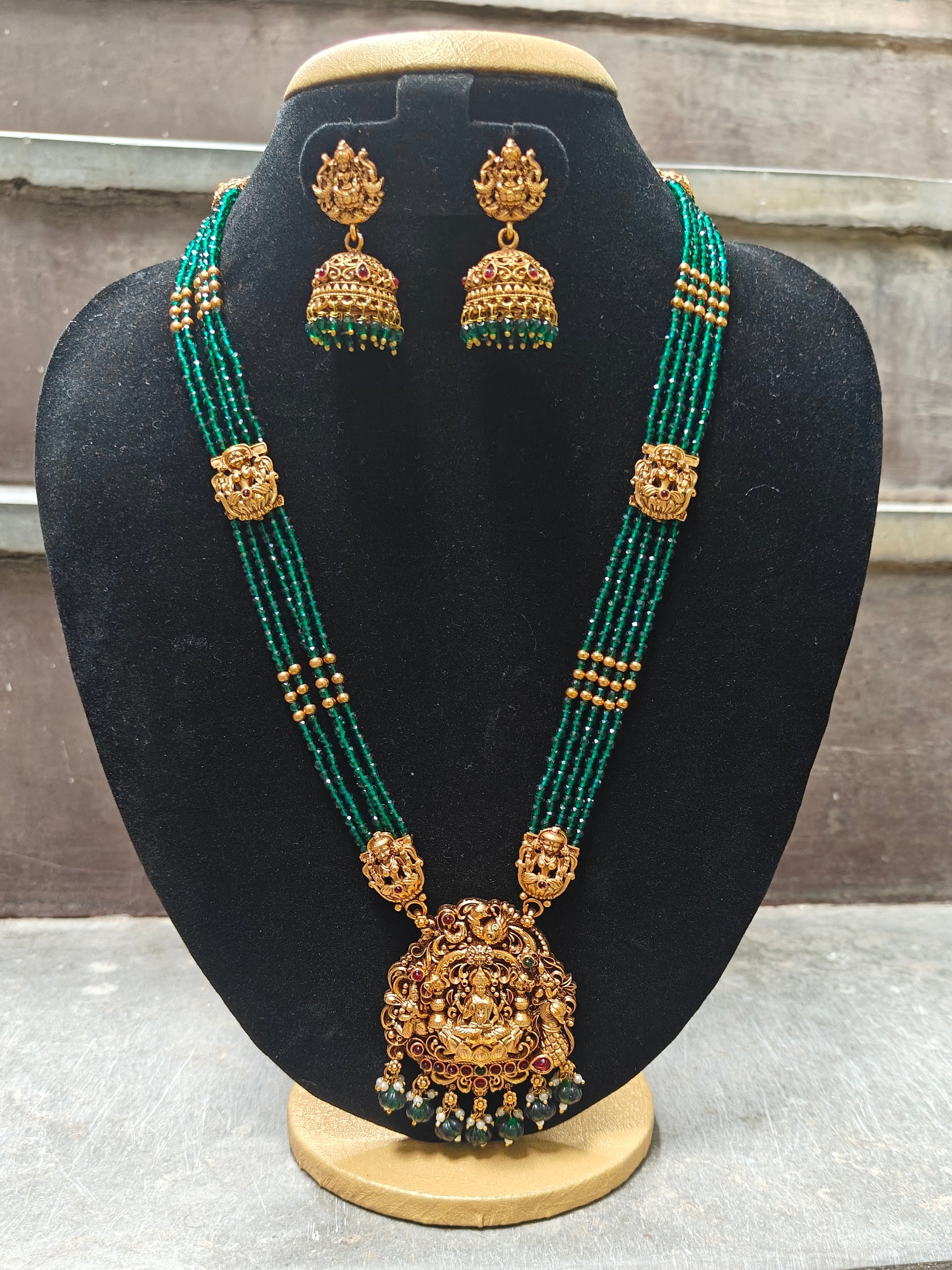 Gold Plated coorgi Pendant with green crystals