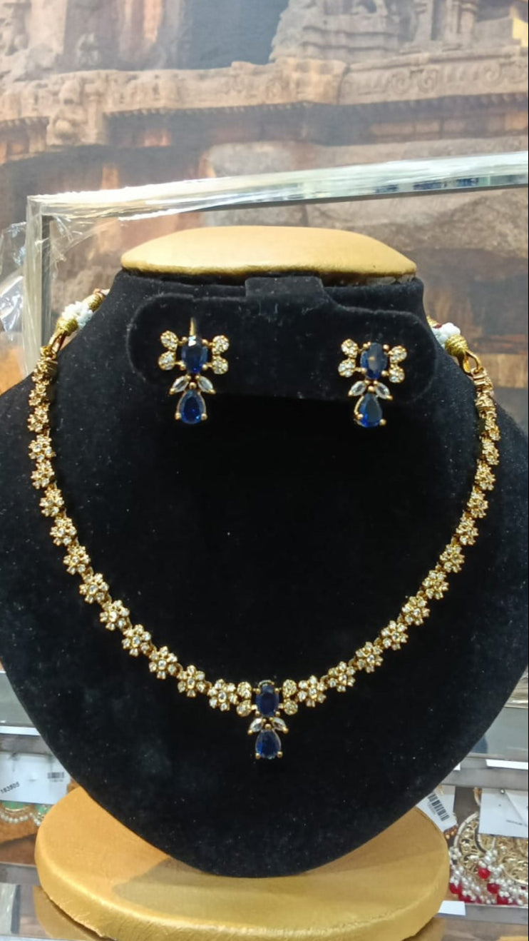 Flower motif with white and blue zercon stones Short necklace set